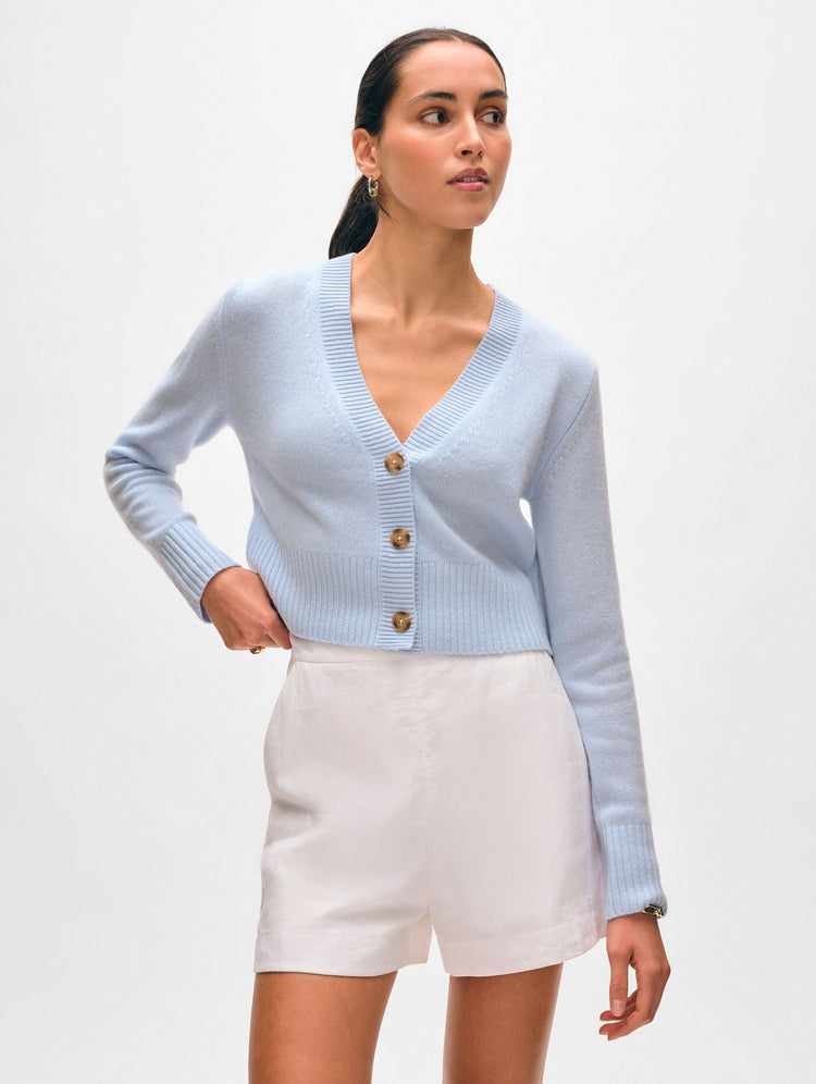 Model wearing pale blue mist button cashmere cardigan.