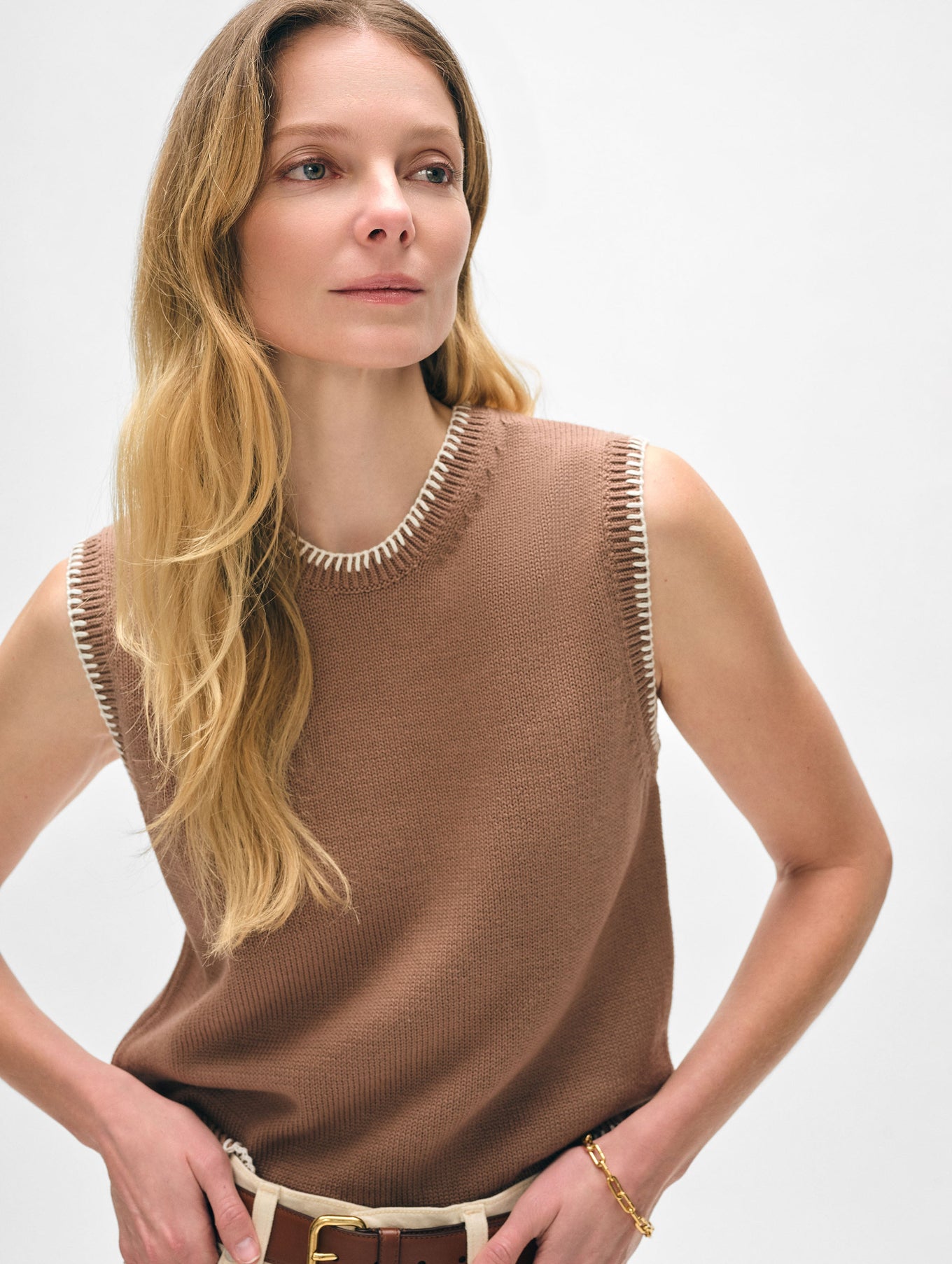 Model wearing brown tank top.