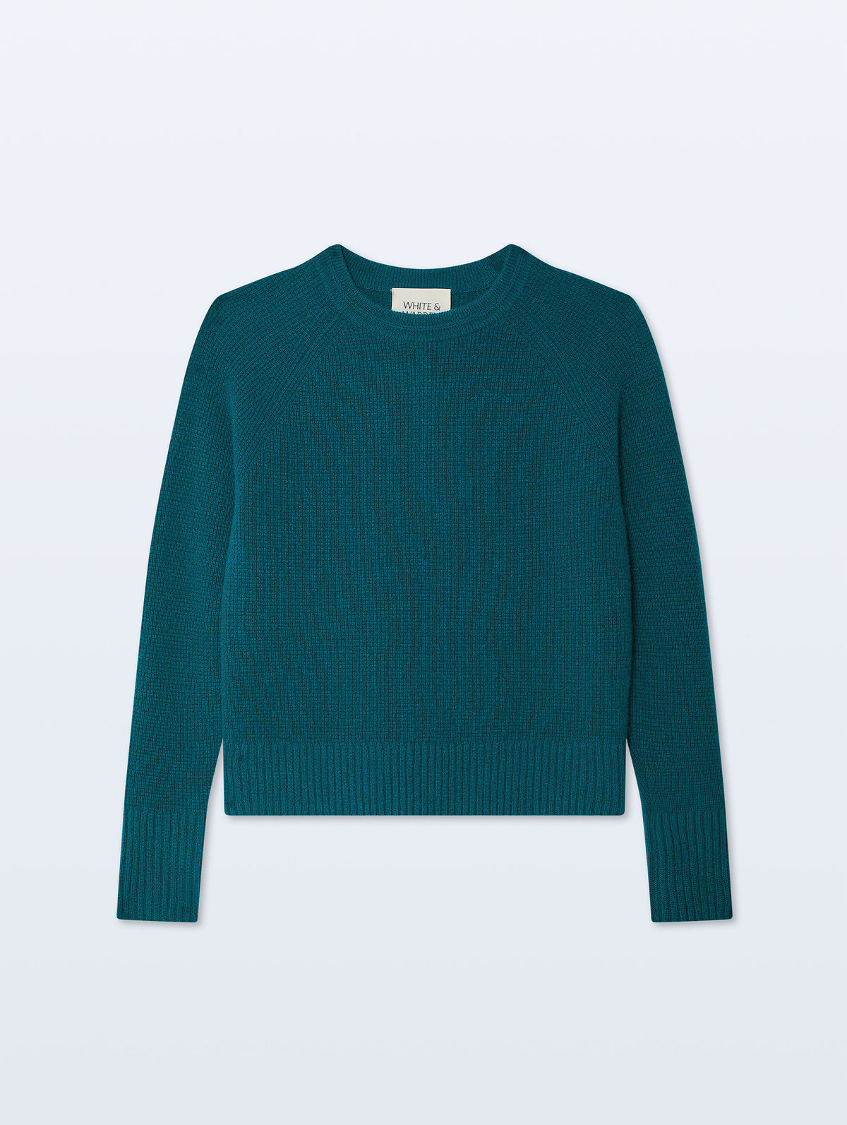 A dark teal green ribbed knit sweater with long sleeves and a crew neck, displayed flat against a light gray background.
