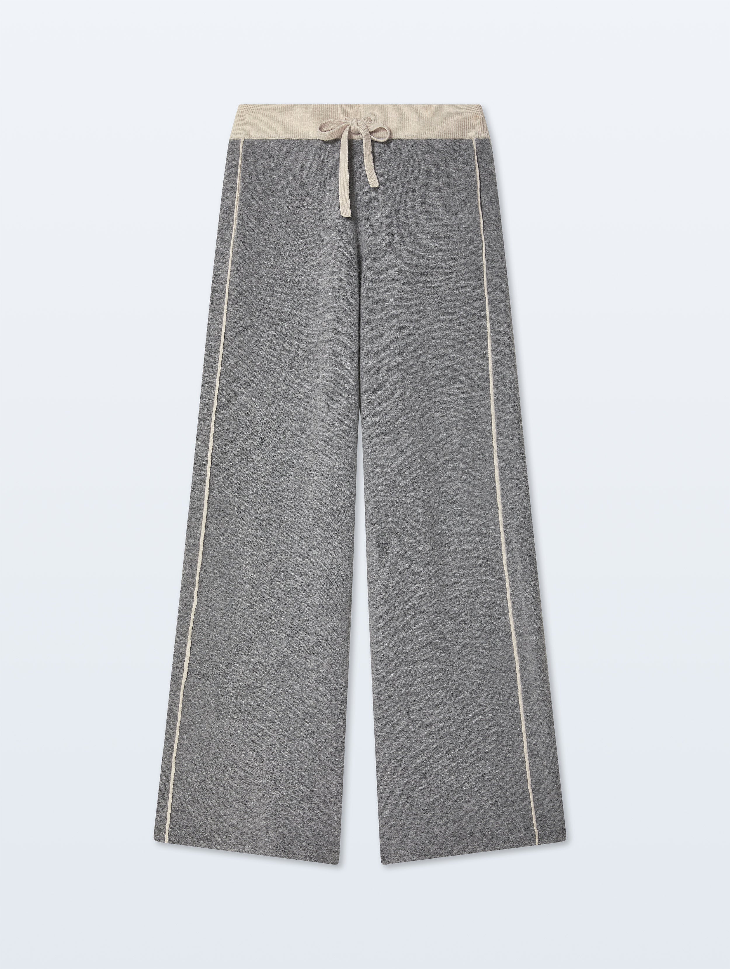 A pair of wide-leg gray sweatpants with a beige elastic waistband and matching drawstring, accented by thin beige side stripes, shown against a light gray background.