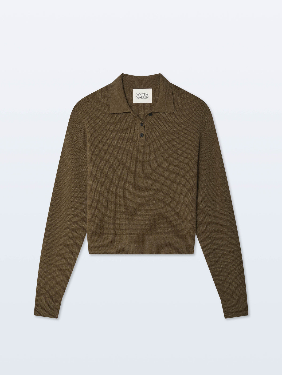 A cropped long-sleeve polo sweater in a dark olive brown color, featuring a three-button placket and ribbed hem, displayed on a light gray background.