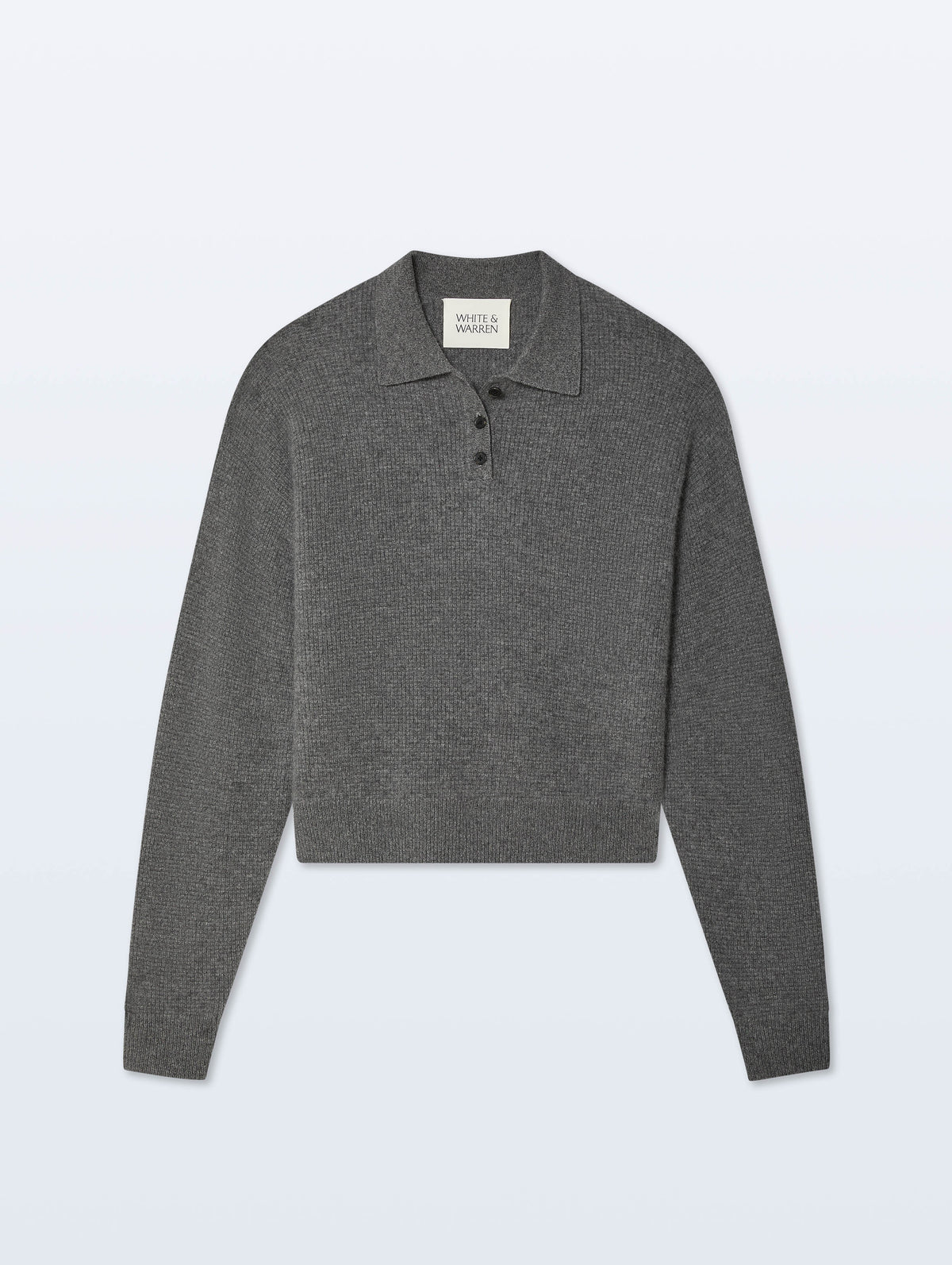 A dark gray cropped long-sleeve polo sweater with a three-button placket, displayed flat against a light gray background.