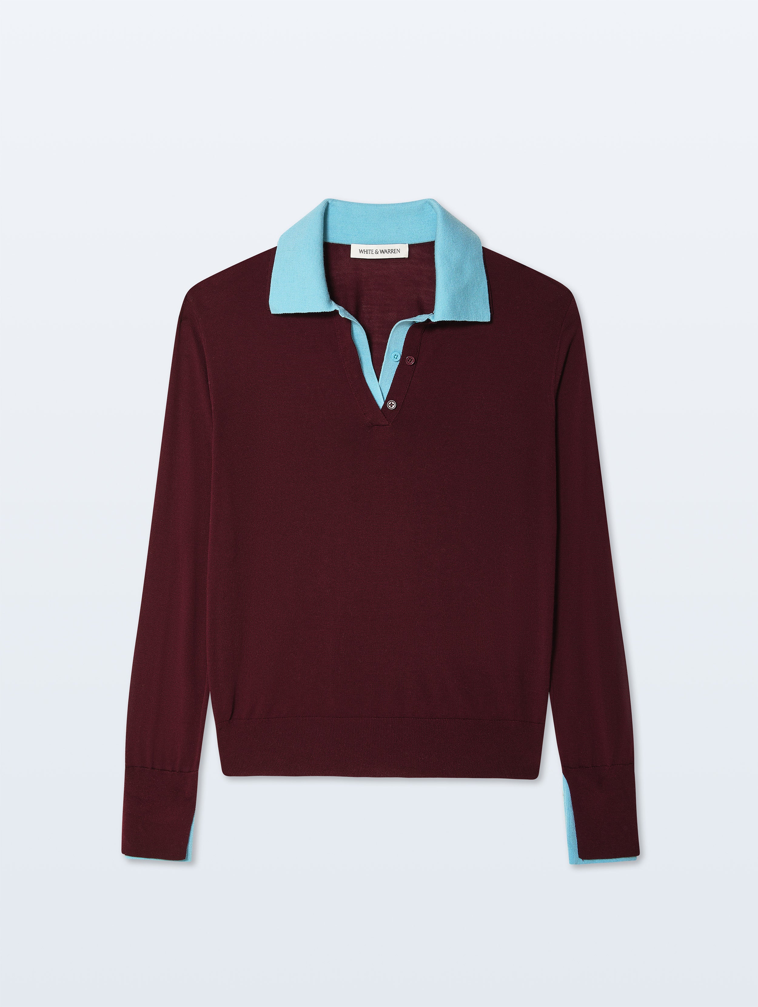A long-sleeve knit polo-style sweater in deep burgundy with a contrasting light blue collar and inner placket, shown flat against a light gray background.